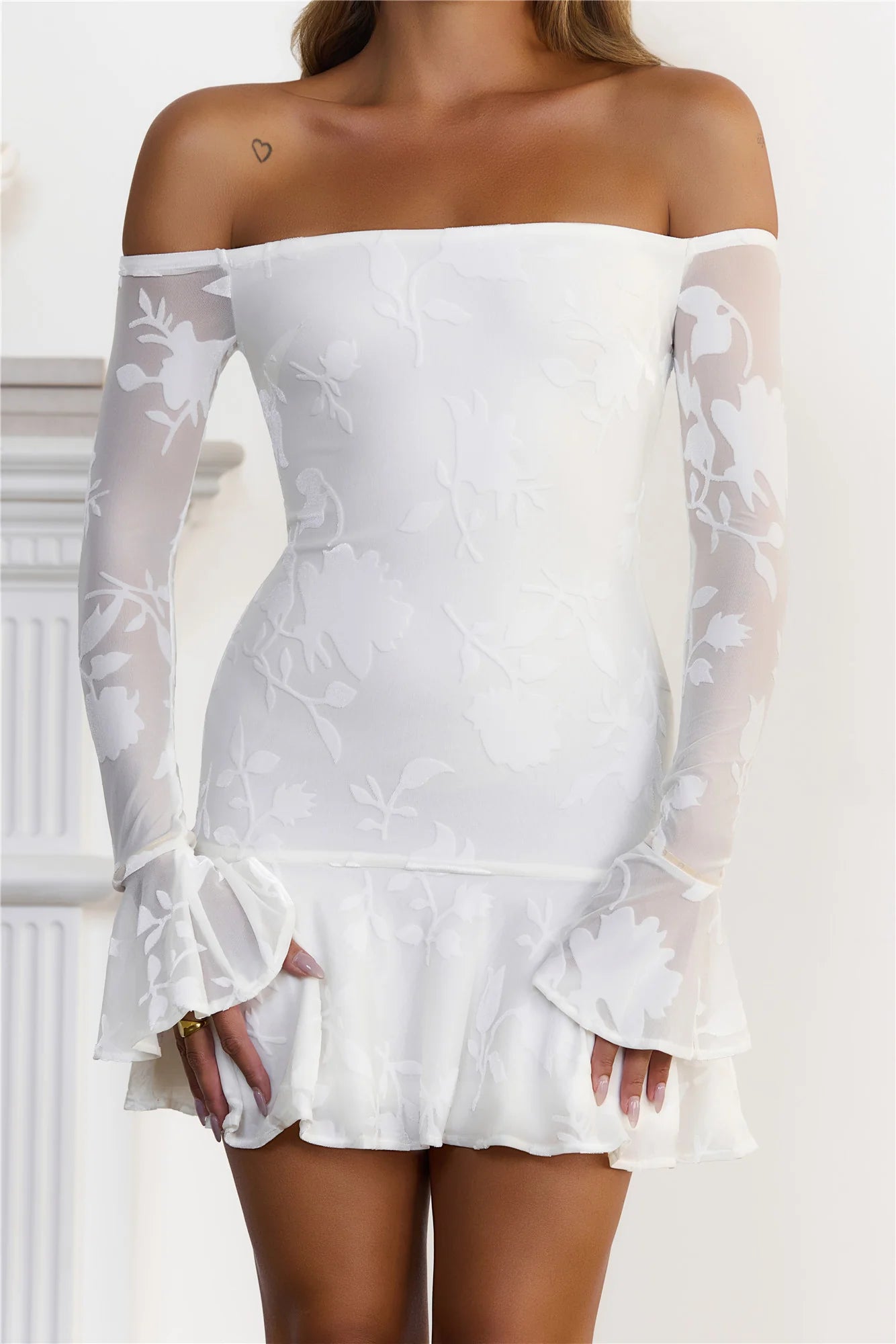 Romantic White Off-the-Shoulder Mini Dress with Floral Burnout Mesh, Sheer Flared Long Sleeves and Ruffled Hem