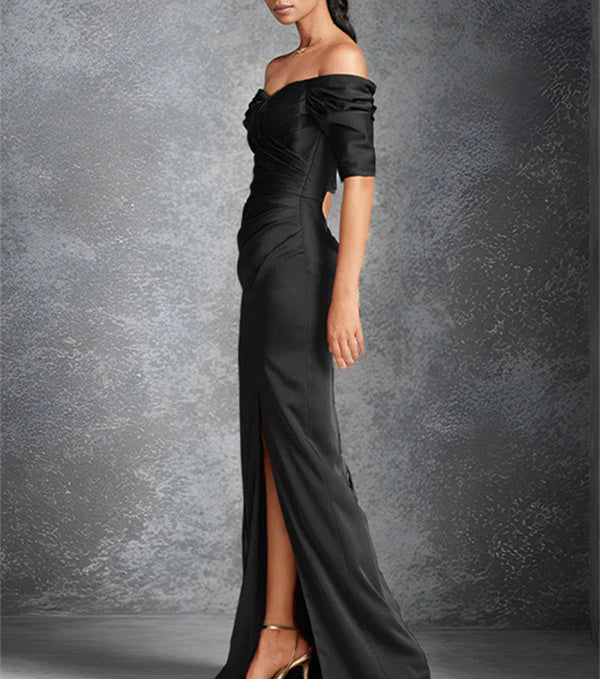 Tight off shoulder short sleeved floor standing bridal dress with front slit