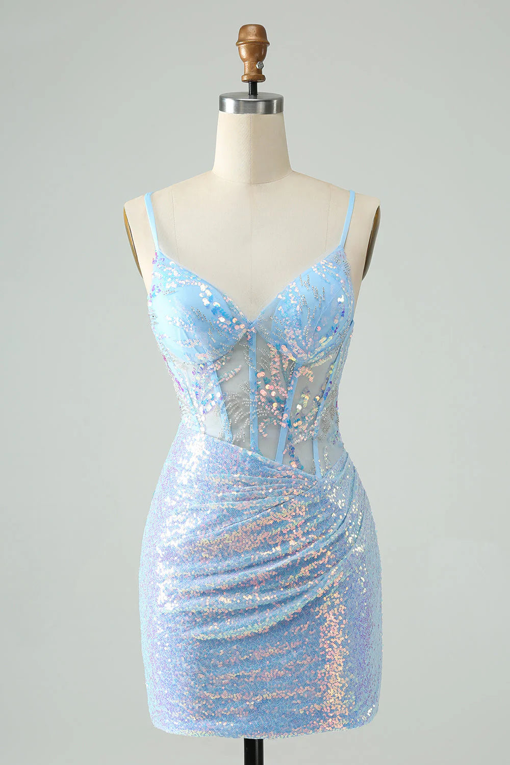 Model wearing a light blue glitter short homecoming dress with spaghetti straps and sequin details.