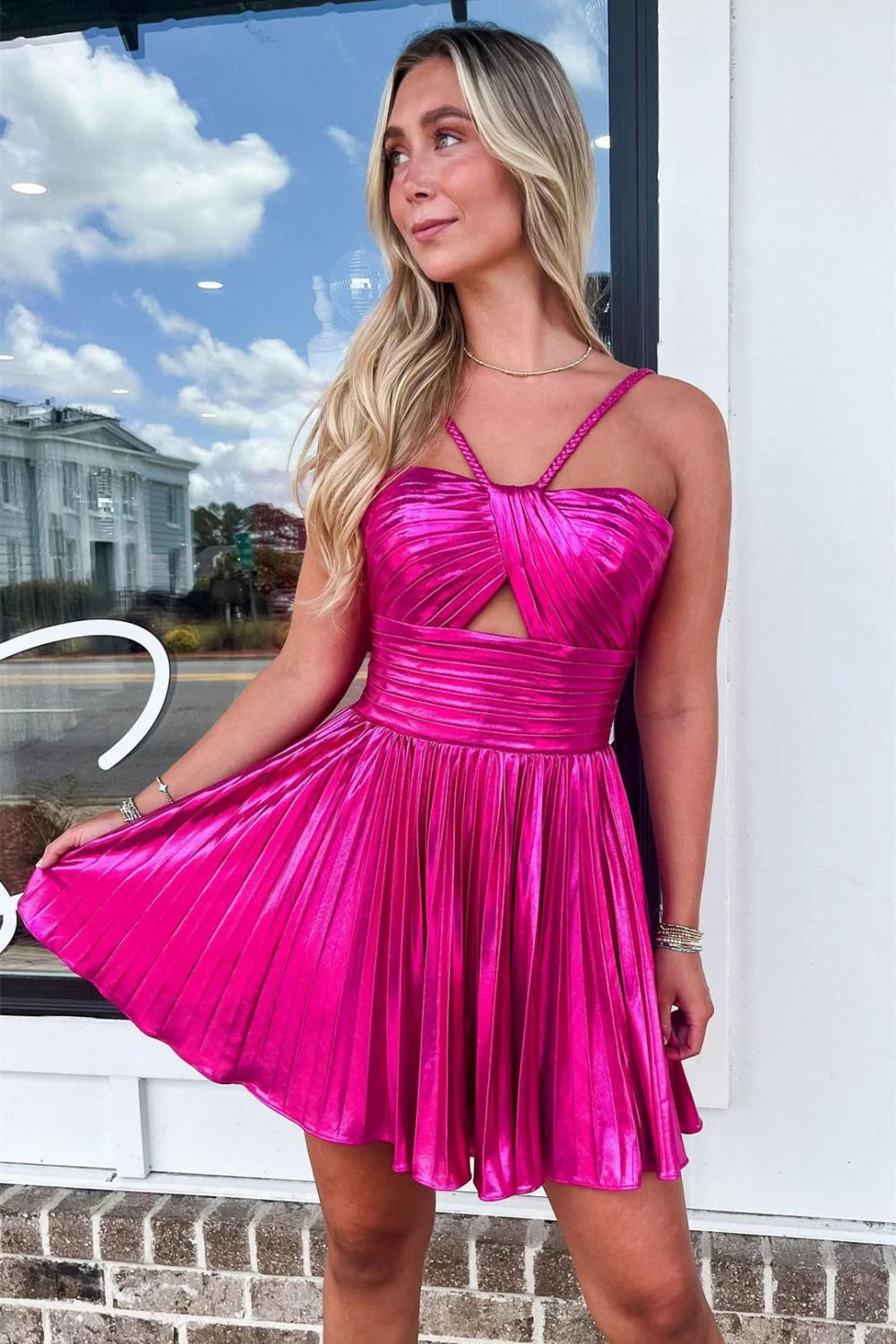 Gold metallic short dress with halter neckline detail.