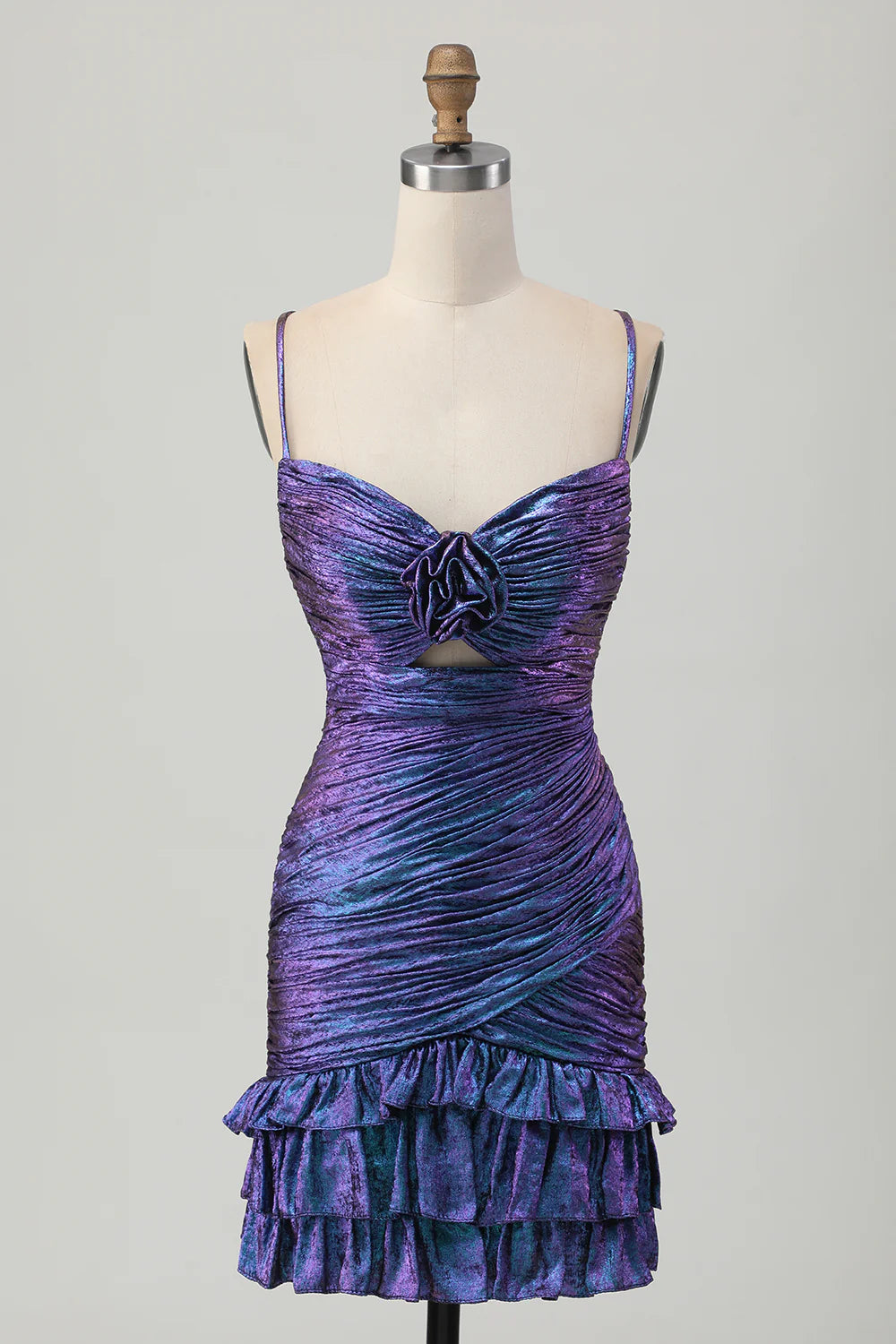 Model wearing a shimmering blue-purple bodycon ruched short homecoming dress with ruffles, front view.