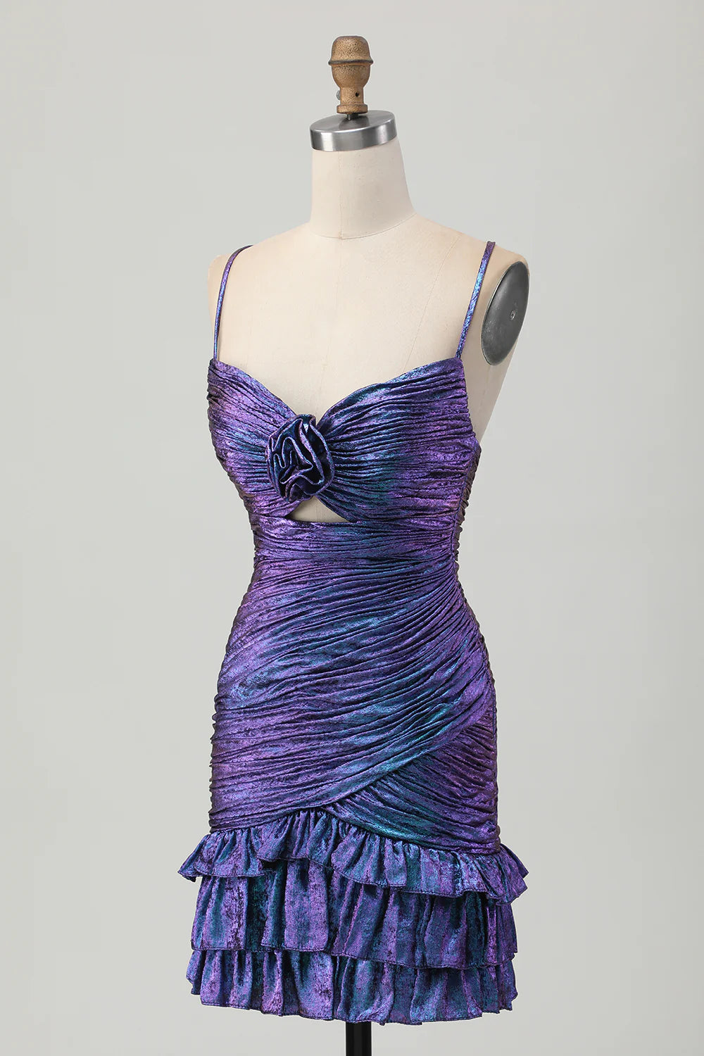 Model wearing a shimmering blue-purple bodycon ruched short homecoming dress with ruffles, back view.