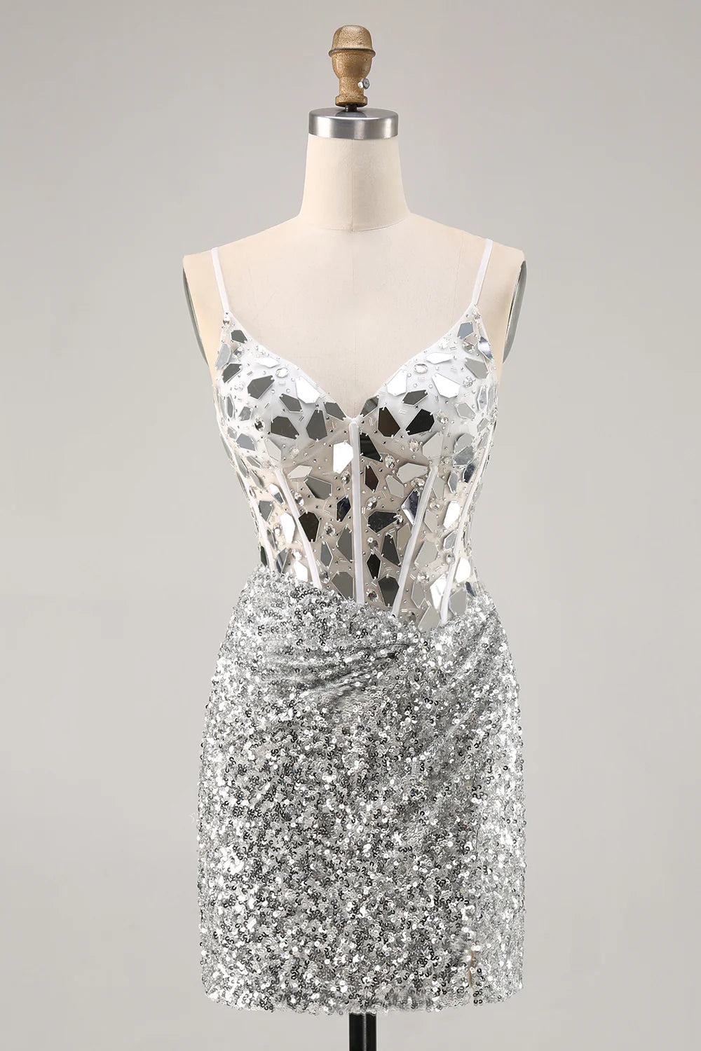 Model wearing a shimmering silver bodycon sequin corset homecoming dress.