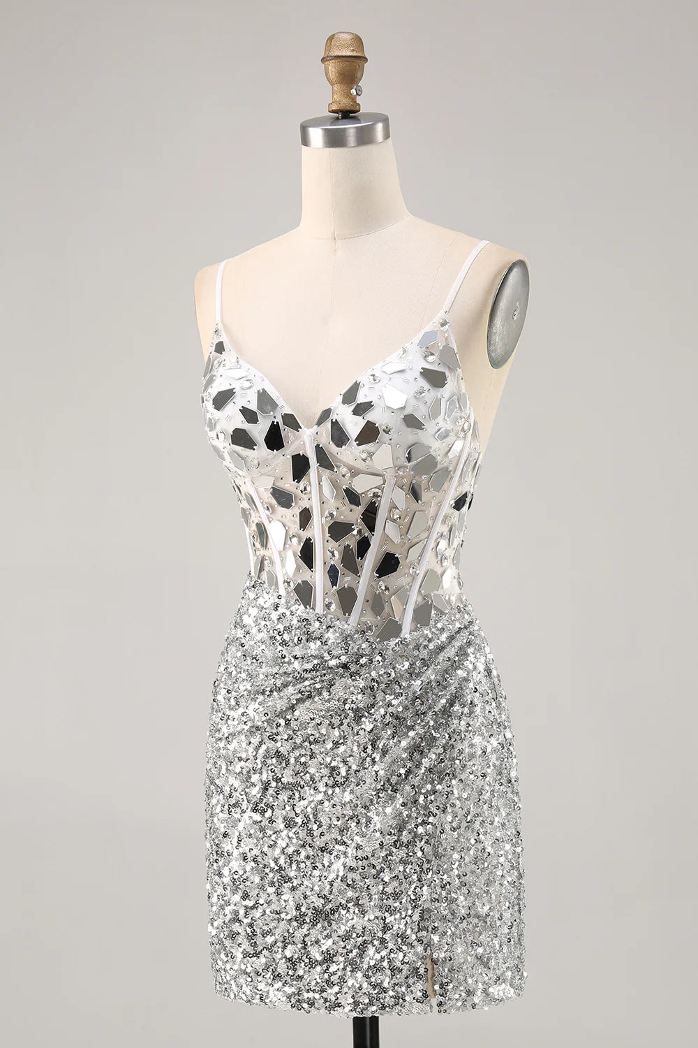 Back view of a model in a shimmering silver sequin ankle-length dress.