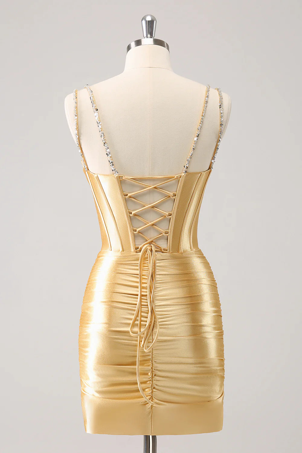 Back view of golden sequin bodycon strapless short homecoming dress.