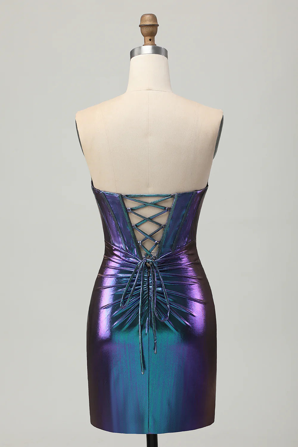 Back view of a metallic strapless blue purple short homecoming dress, showcasing the corset detail.