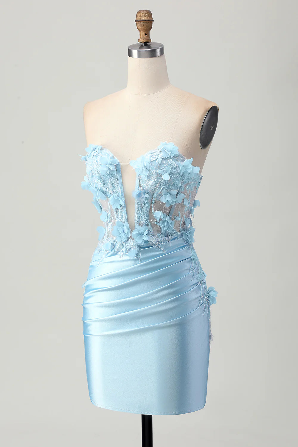 Close-up of the sequin and 3D flower details on the sky blue dress.