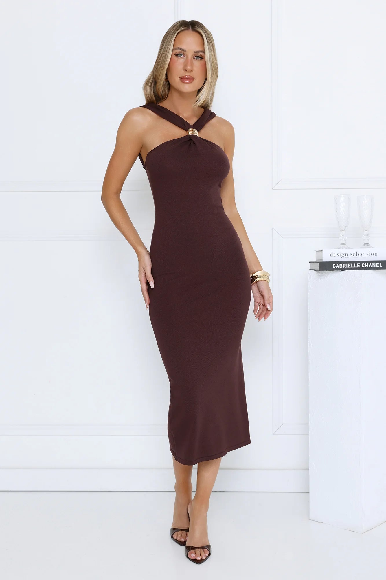 Sleek Chocolate Brown Halter Neck Midi Dress with Gold Buckle Accent, Form-Fitting Bodycon Silhouette, Low Square Open Back and Flared Mermaid Hem