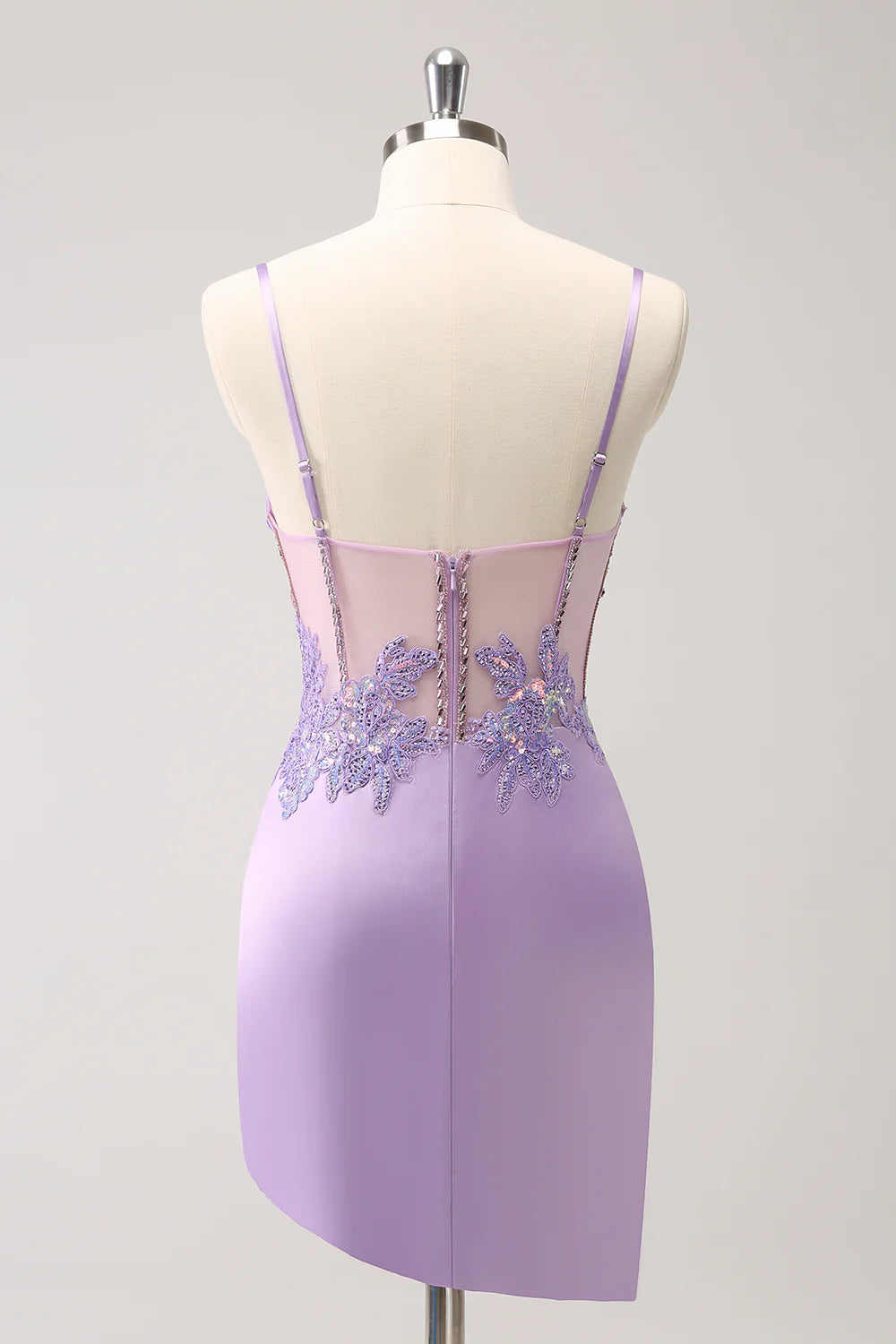 Back view of a model in a purple sequin strapless homecoming dress.