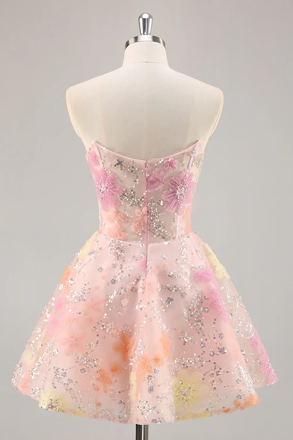 Back view of the pink A-line strapless sequin dress.
