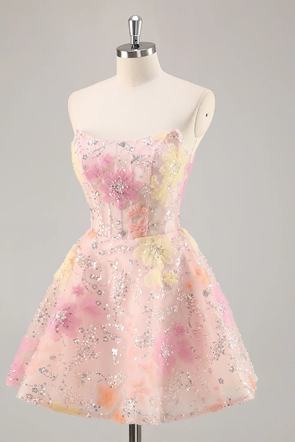 Side view of the pink A-line strapless sequin dress.