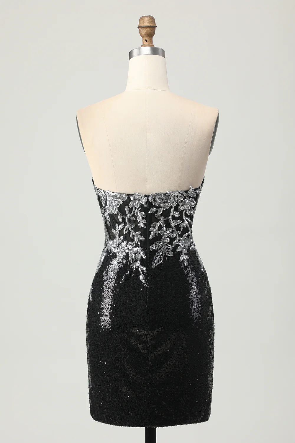 Close-up of the black and silver floral sequin pattern on the short homecoming dress.