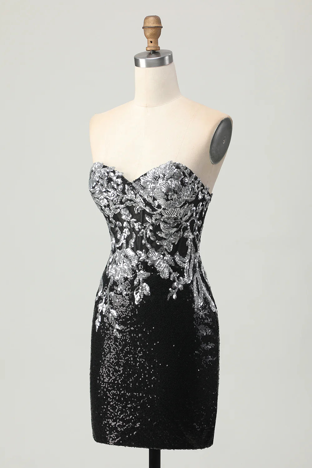 Back view of the black and silver sequin short homecoming dress, showcasing its fitted silhouette.