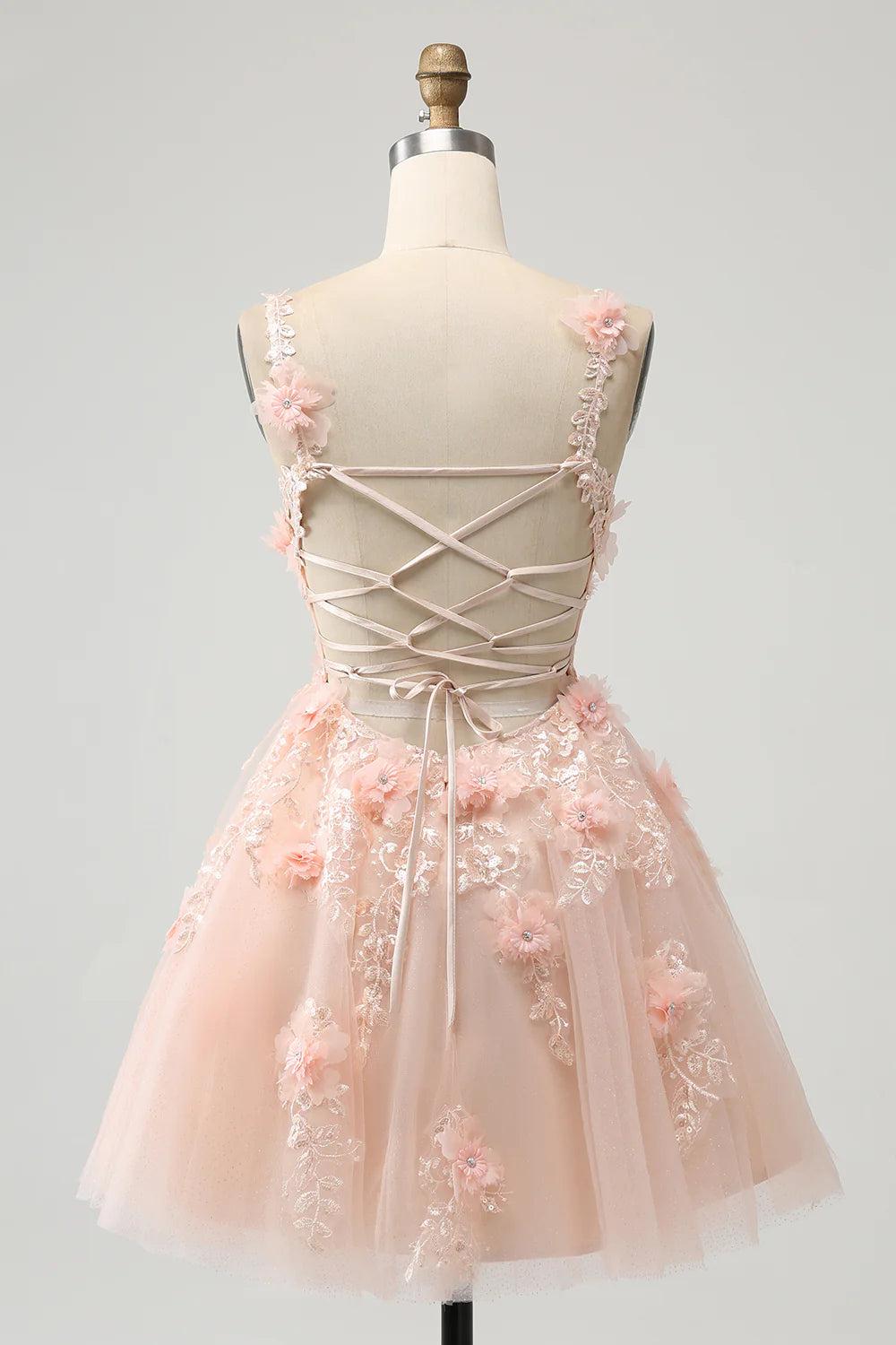 Side view of blush A-line sequin homecoming dress with appliques.