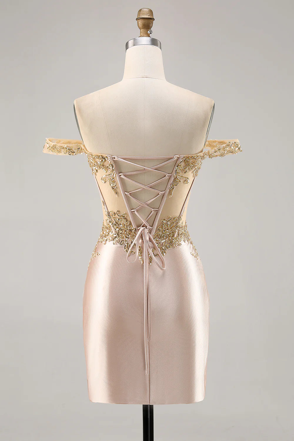 Back view of champagne sequined satin bodycon dress with off-shoulder neckline.