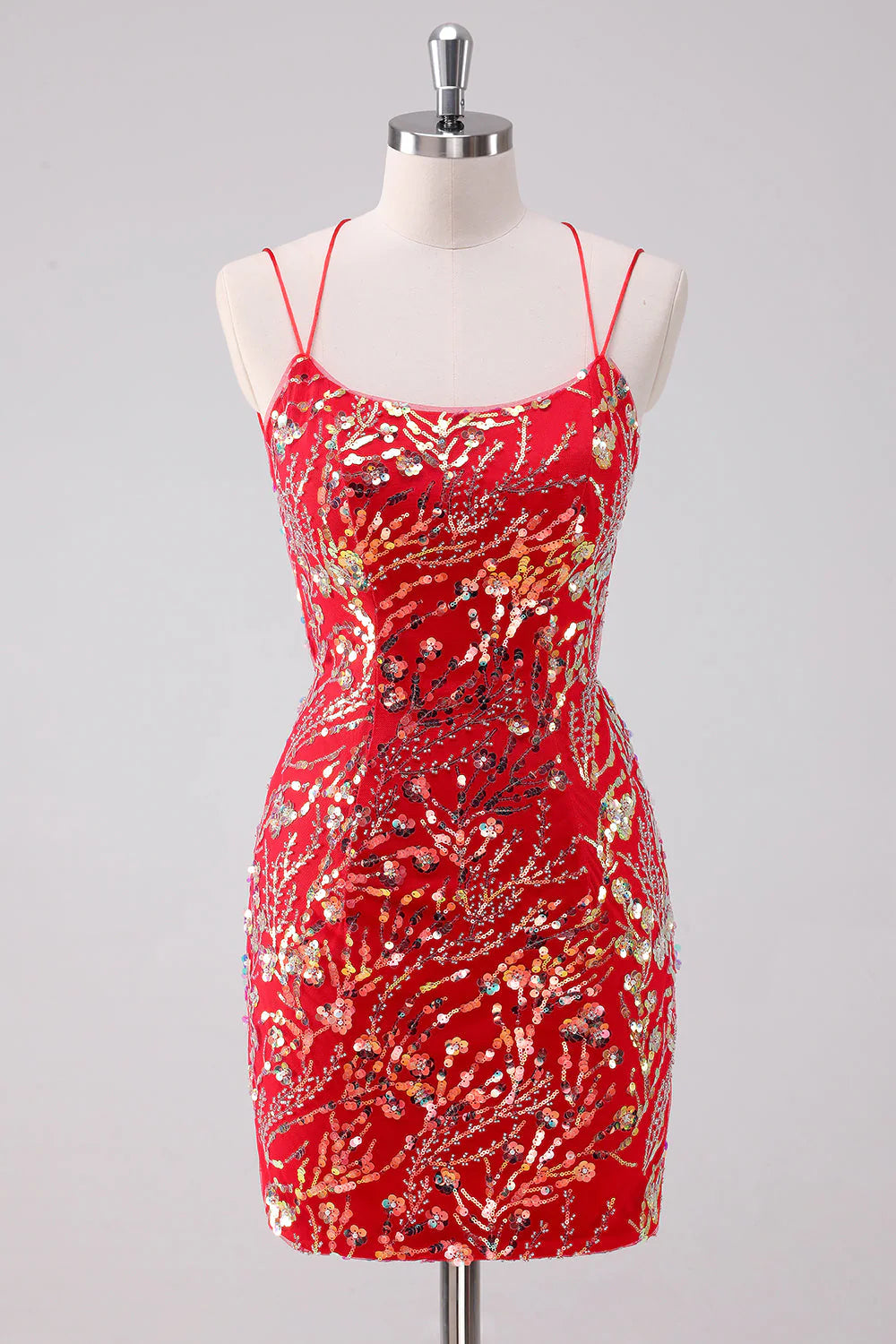 Model wearing a sparkling red sequin bodycon short homecoming dress with spaghetti straps.