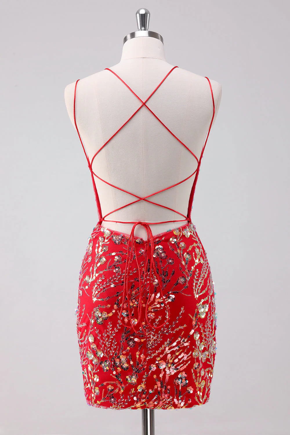 Side view of a model in a glitter red short bodycon dress with spaghetti straps.
