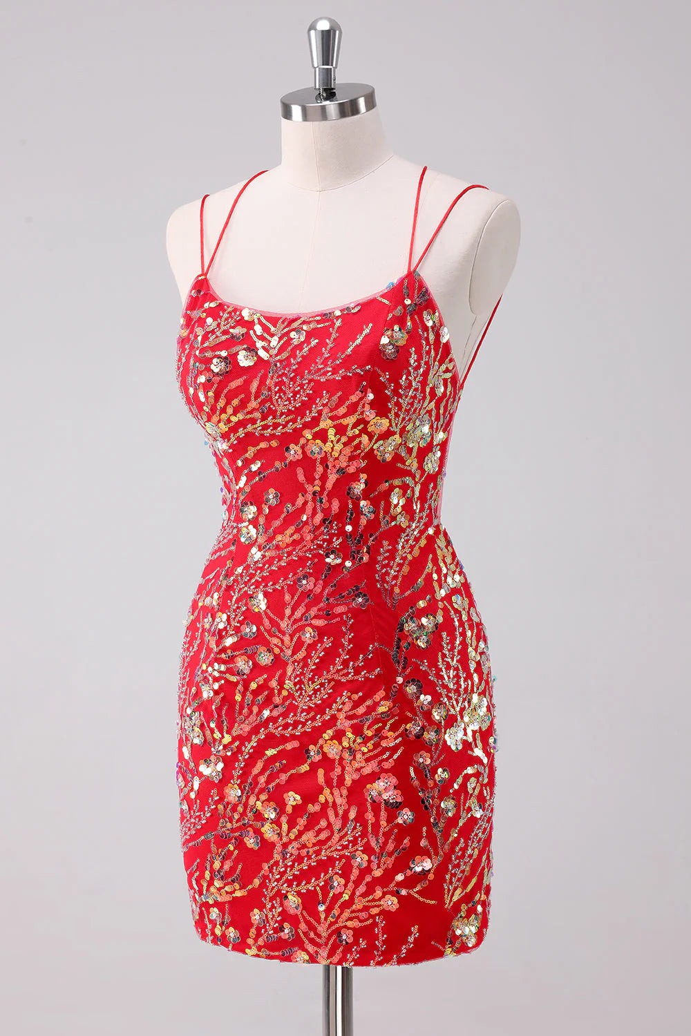 Close-up of the sequin and glitter detail on a red short homecoming dress.