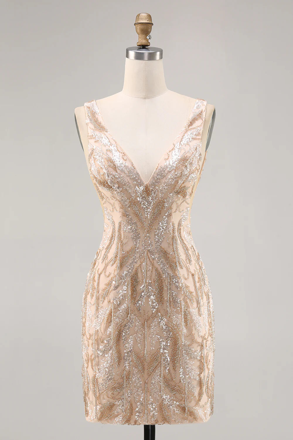 Model wearing a sparkling champagne V-neck sequined bodycon homecoming dress, front view.