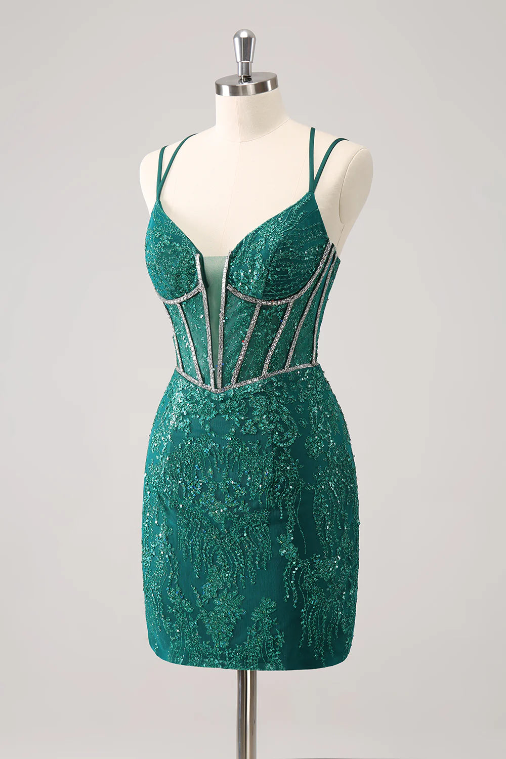 Side view of a model in a dark green sparkling short homecoming dress.
