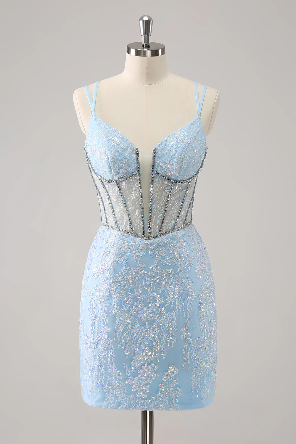 Model wearing a sparkling light blue corset short homecoming dress with spaghetti straps, front view.