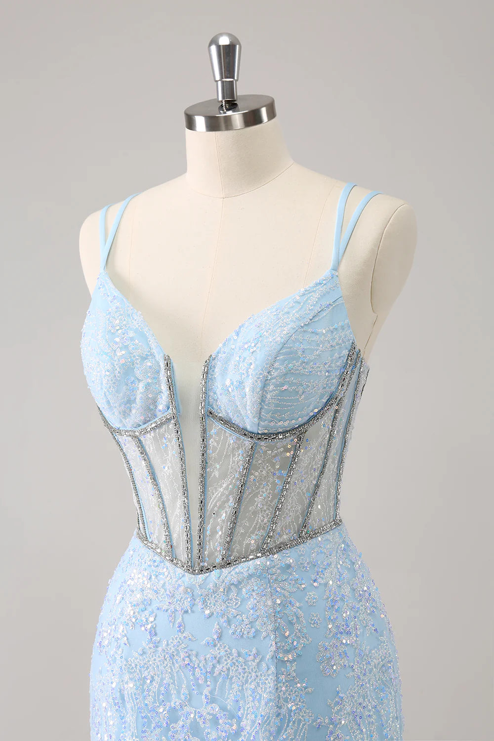 Side view of a model in a light blue sparkling short homecoming dress.