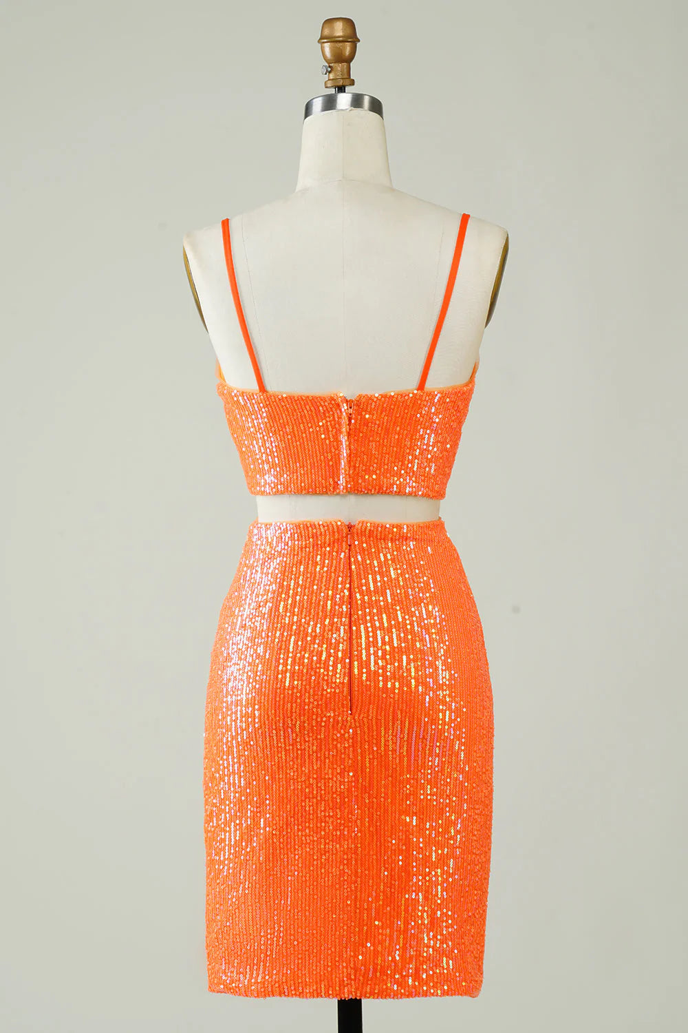 Back view of the orange sequin two-piece homecoming dress, showing the floor-length skirt.