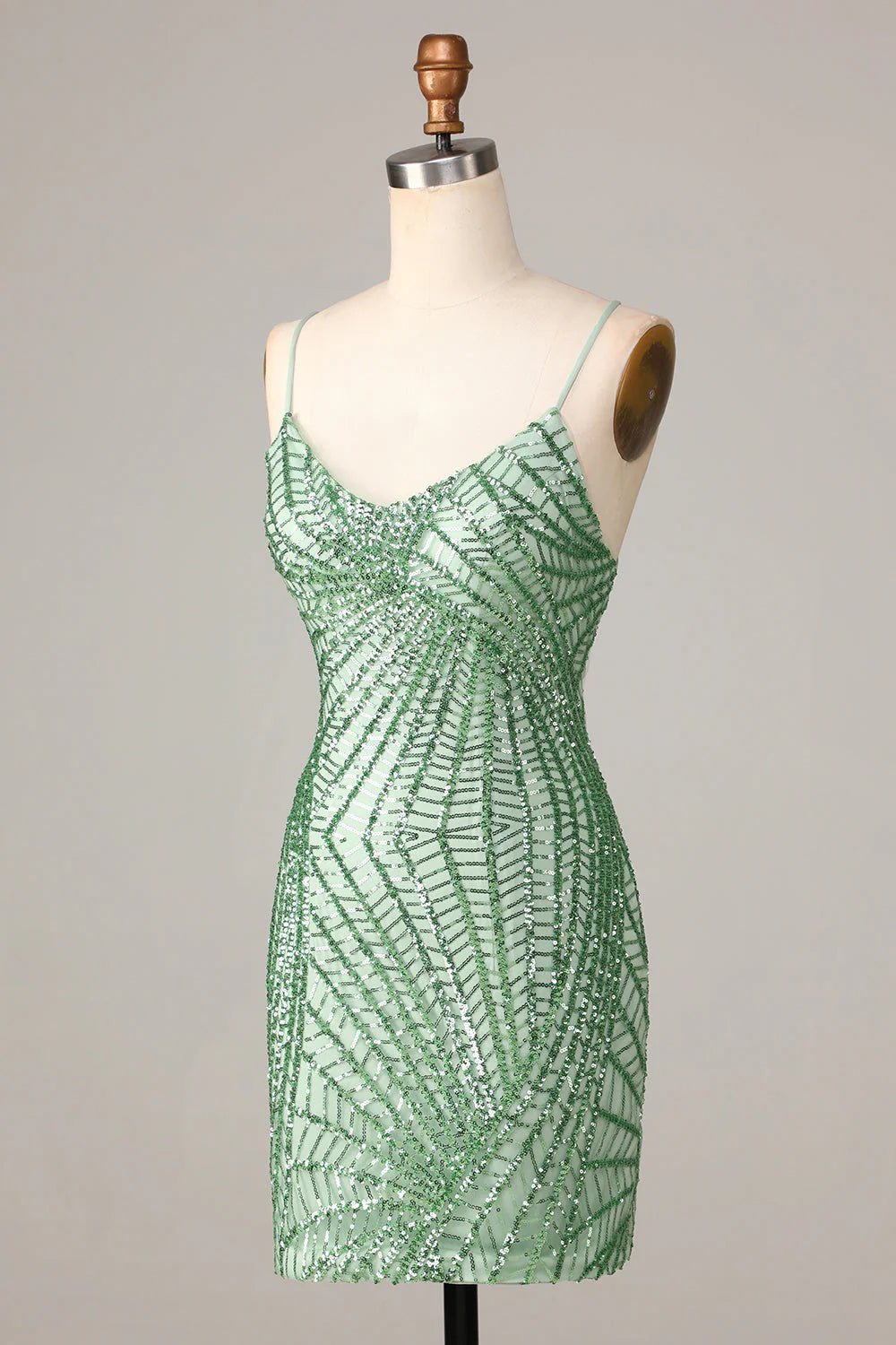 Side view of green sequin sheath short dress.