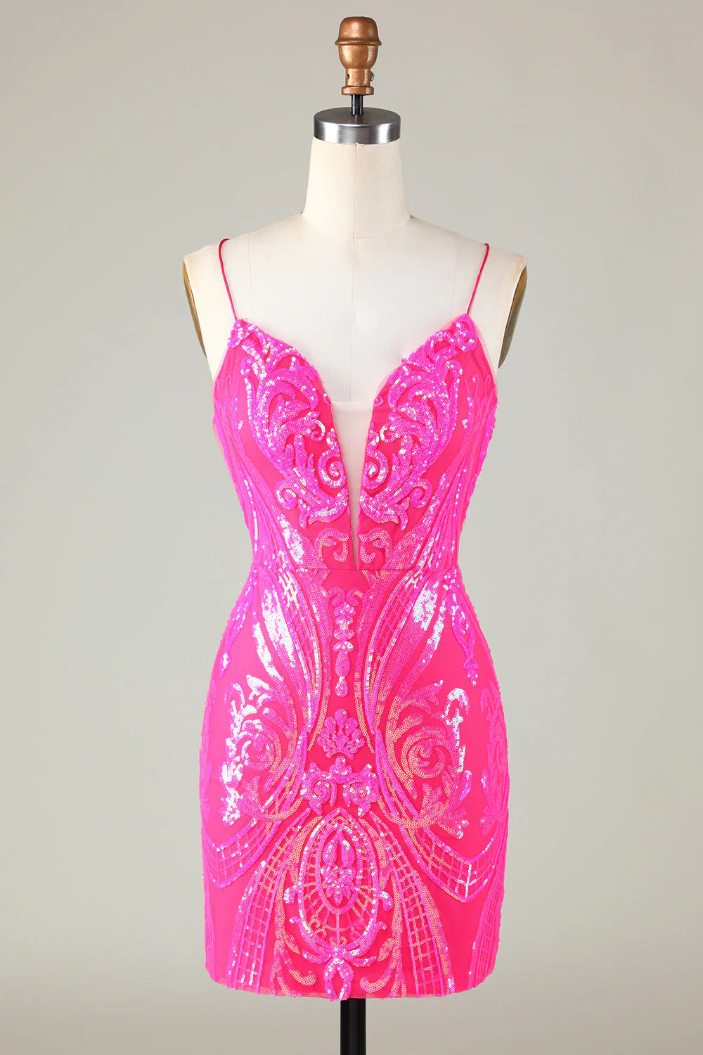 Model wearing a hot pink glitter bodycon short homecoming dress.