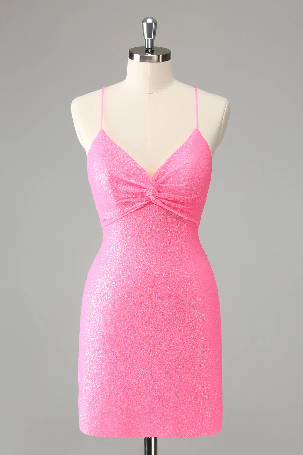 Front view of a sparkling pink sequined bodycon homecoming dress with spaghetti straps.