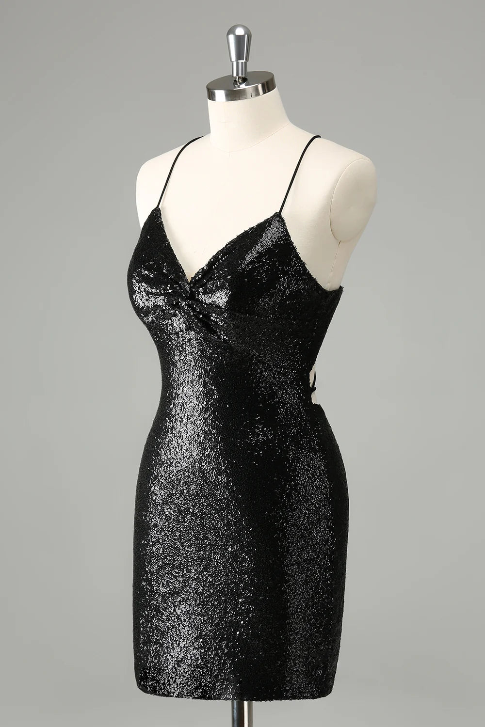 Front view of a black sequined bodycon homecoming dress with spaghetti straps.