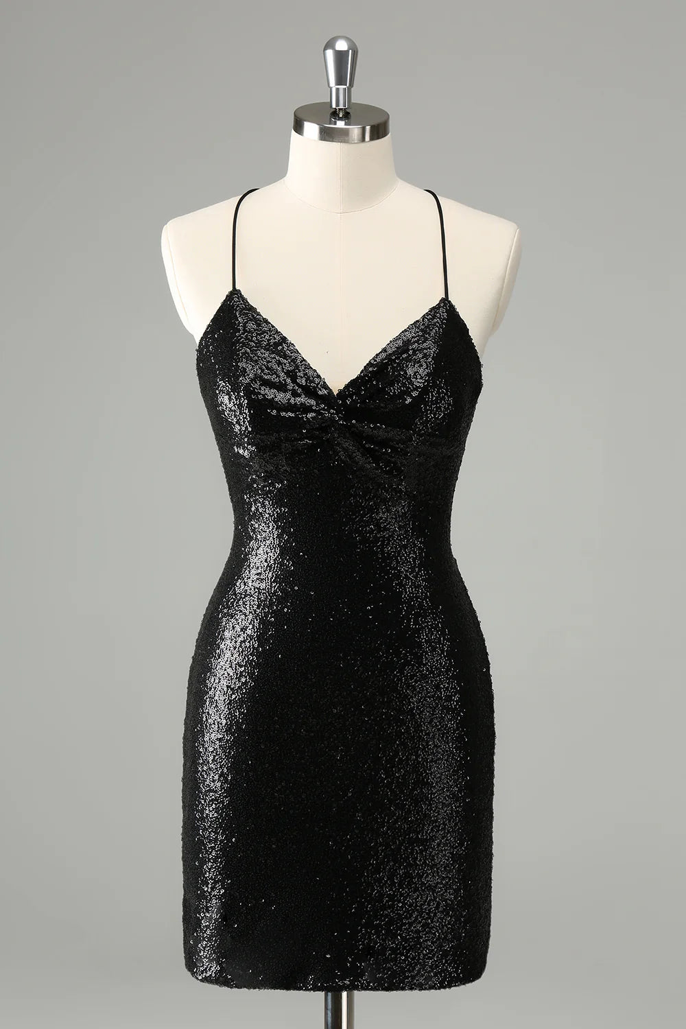 Side view of a black sequined bodycon homecoming dress.