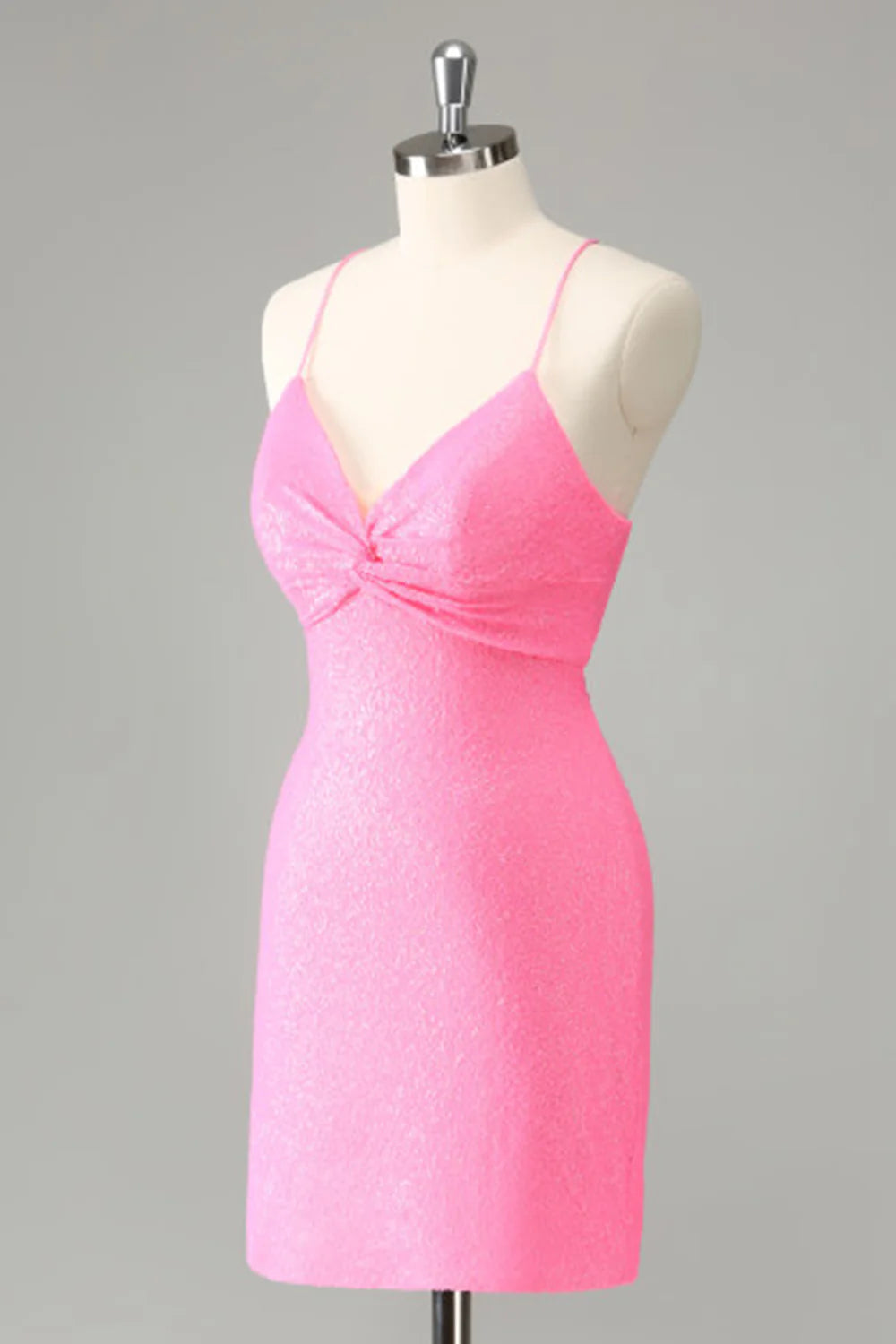 Side view of a pink sequined bodycon homecoming dress.