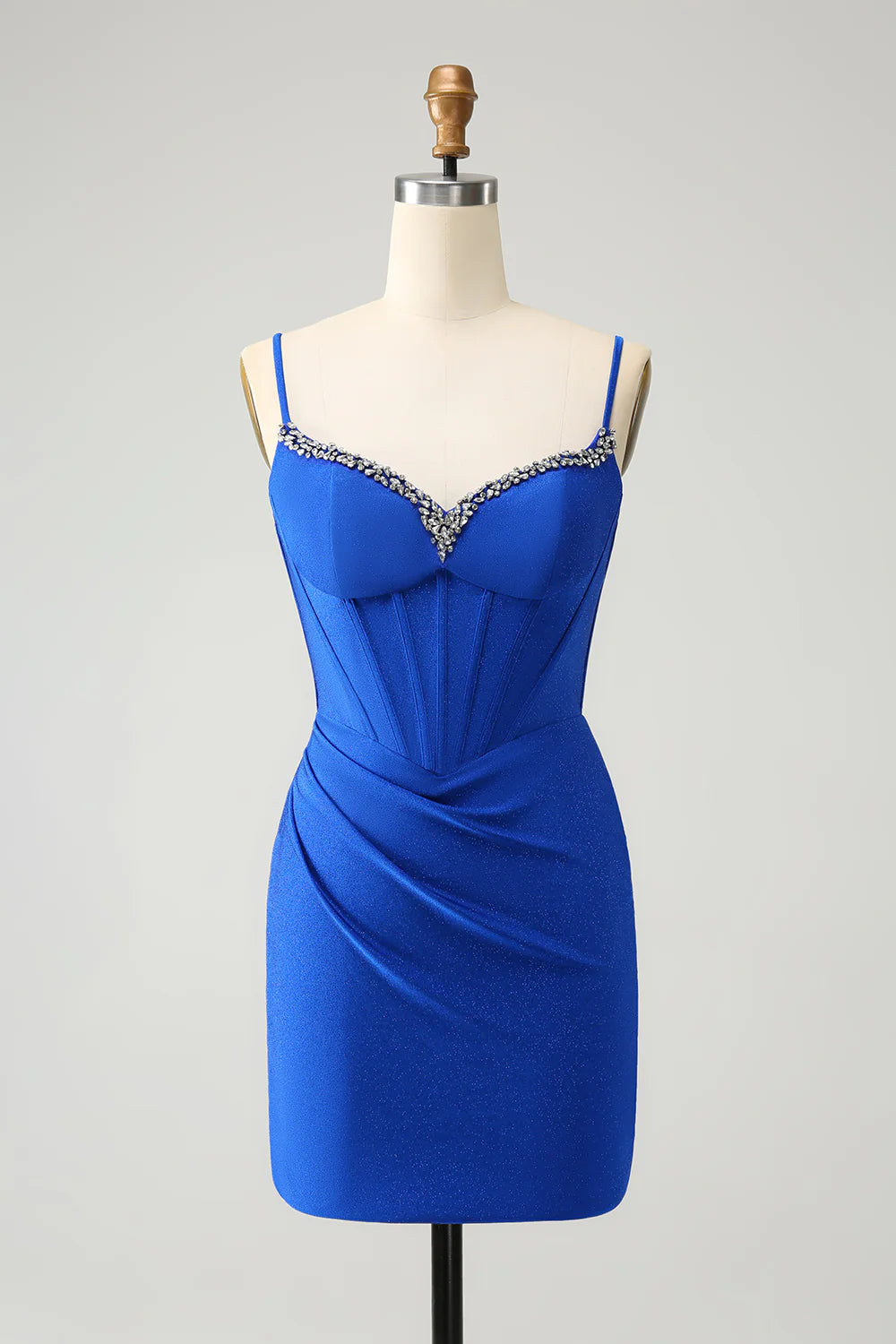 Royal blue glitter corset homecoming dress with beading and spaghetti straps.