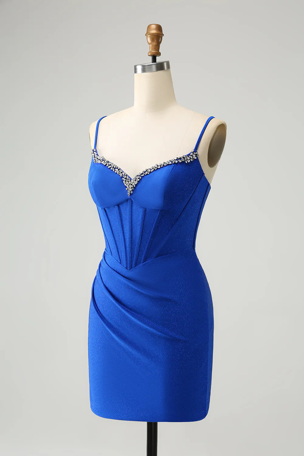 Back view of royal blue corset dress, highlighting the tight fit and sparkling fabric.