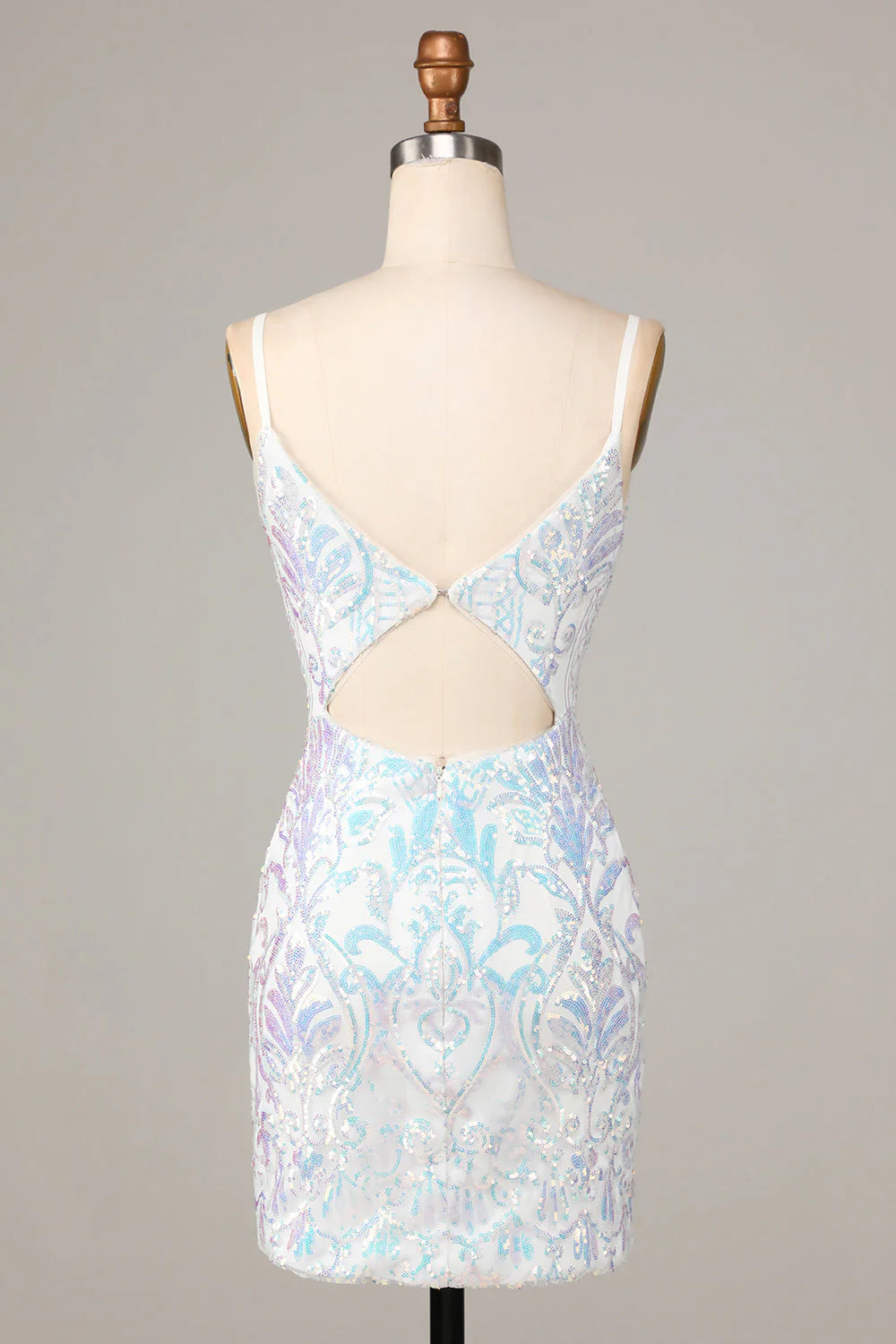 Side view of the white sequin short dress, highlighting its fitted silhouette.