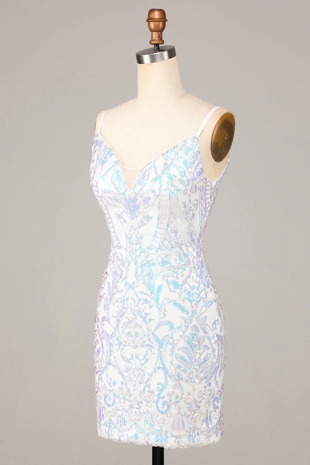 Back view of the white sequin spaghetti strap dress, showing its elegant design.