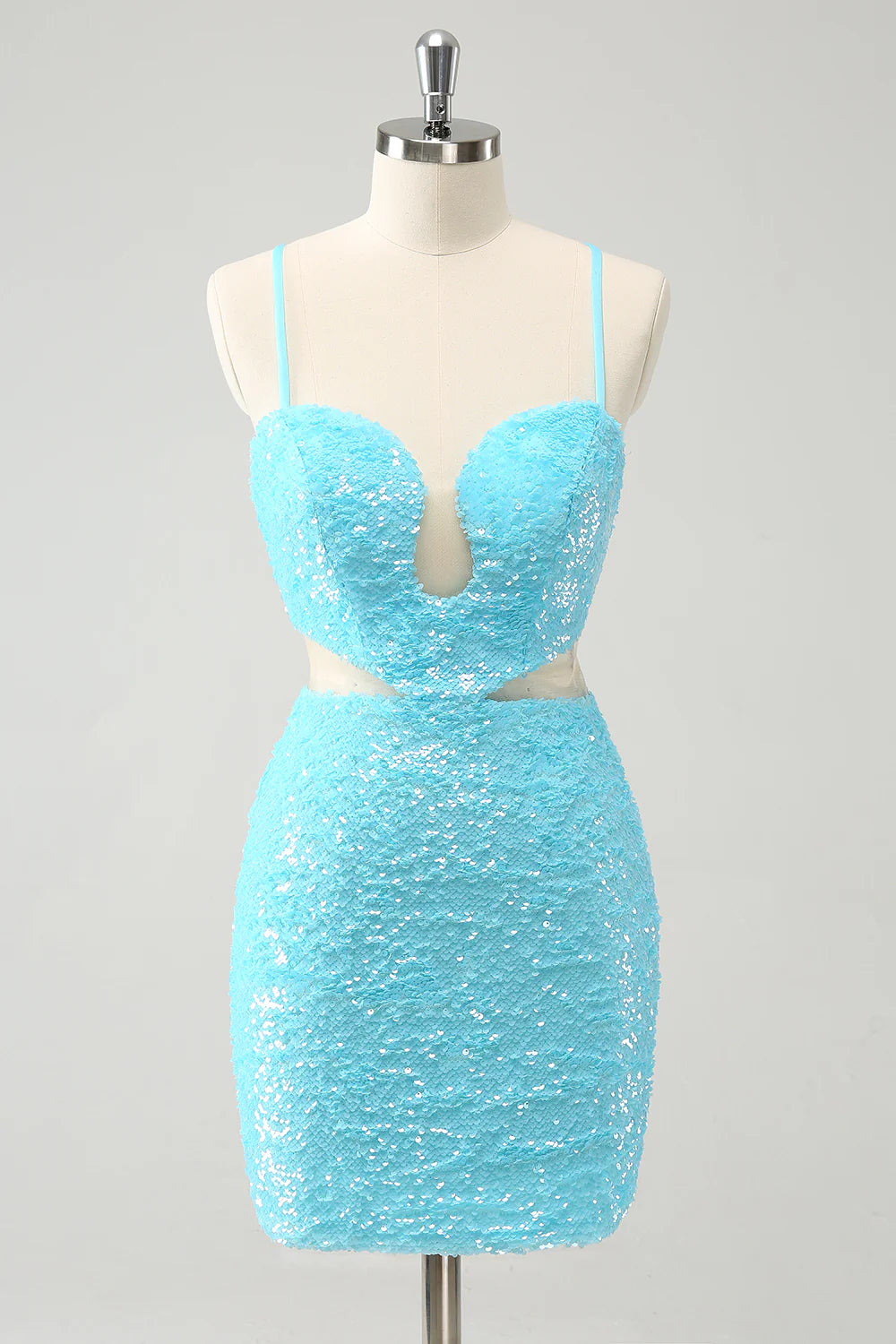 Model wearing a sparkly light blue sequin homecoming dress with spaghetti straps, front view.