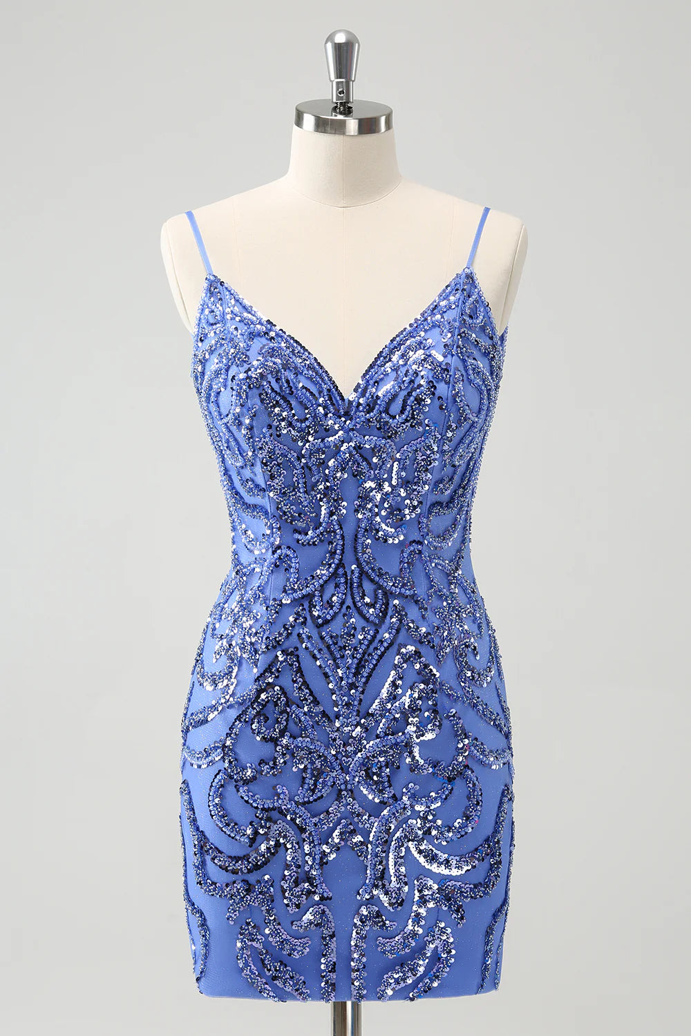 Model wearing a sparkling blue spaghetti strap short sequin homecoming dress.
