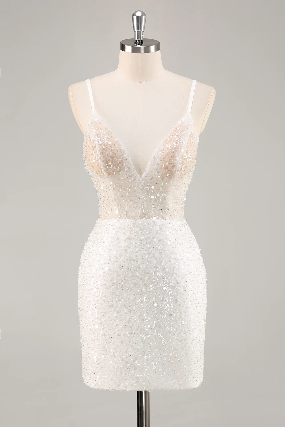Model wearing a white sequin spaghetti strap fitted homecoming dress.