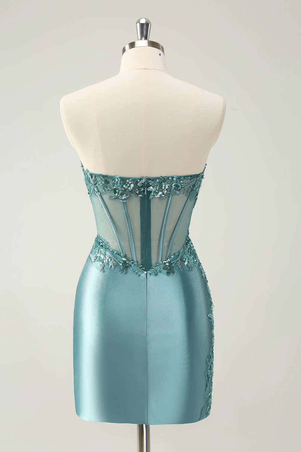Back view of peacock blue strapless glitter dress with corset lacing.