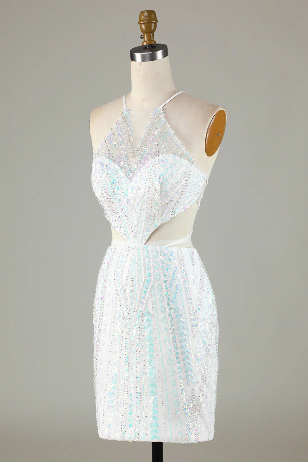 Side view of the white sequin halter dress, highlighting its tight silhouette.