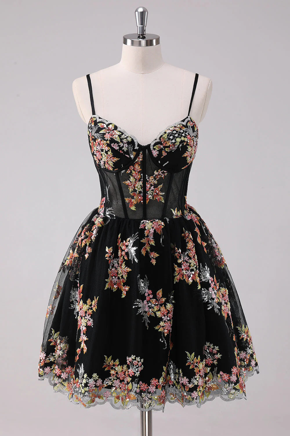 Sparkly black A-line homecoming dress with spaghetti straps and corset bodice.
