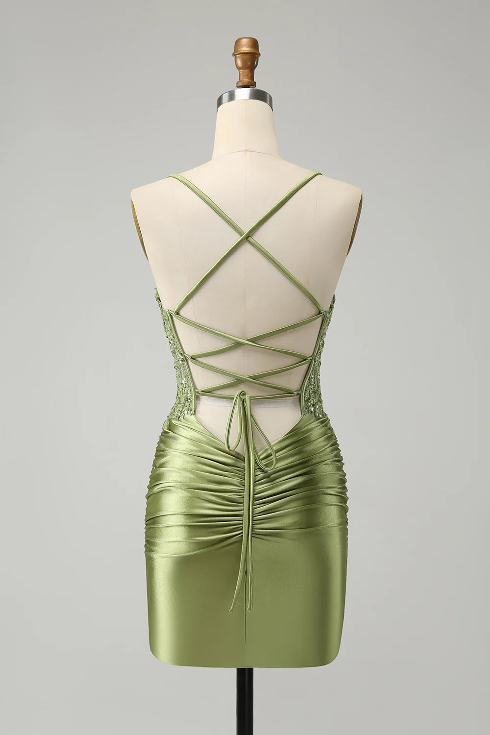 Side view of the light green sequin homecoming dress, showcasing the A-line silhouette.