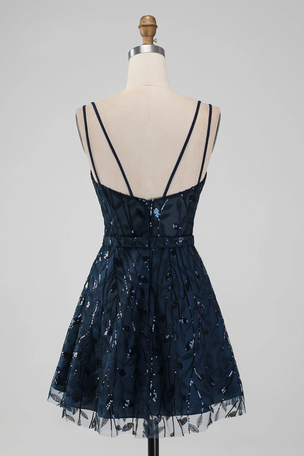 Back view of a sparkly navy sequin A-line homecoming dress.
