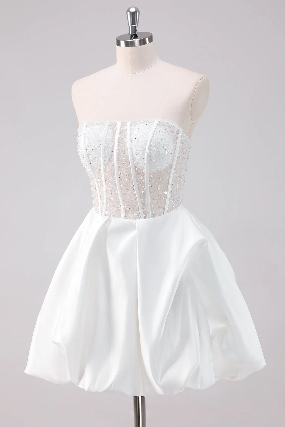 Side view of a model showcasing a sparkly white A-line strapless corset short homecoming dress.