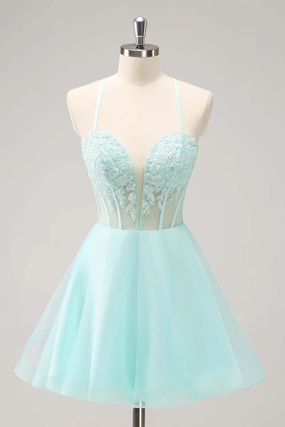 Sparkly green A-line homecoming dress with corset bodice and appliques.