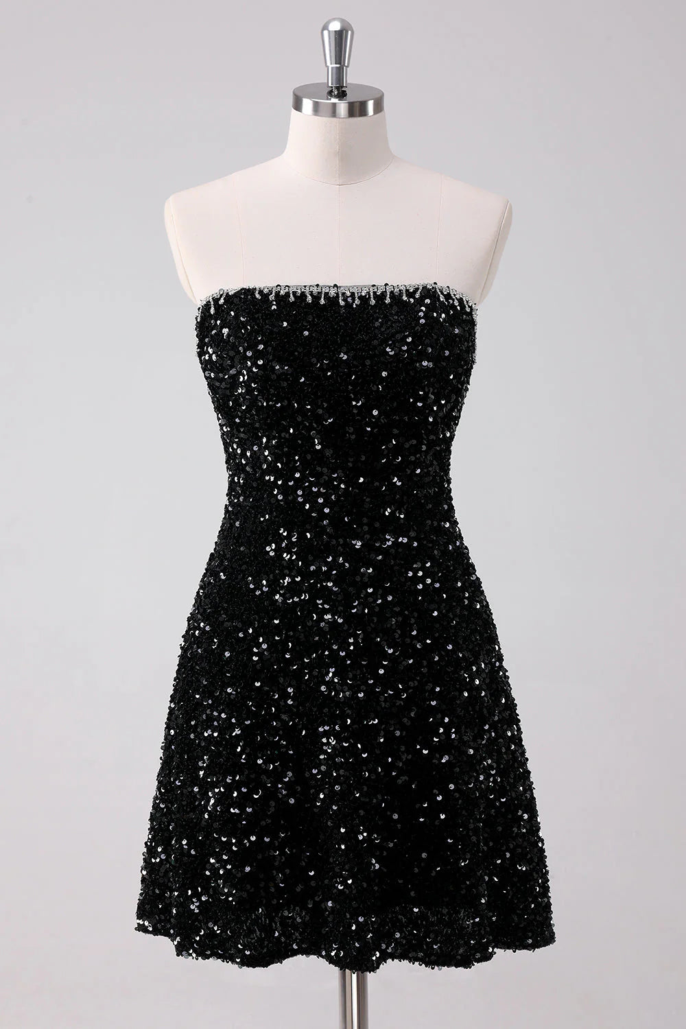 Sparkly black A-line strapless short homecoming dress with sequins.