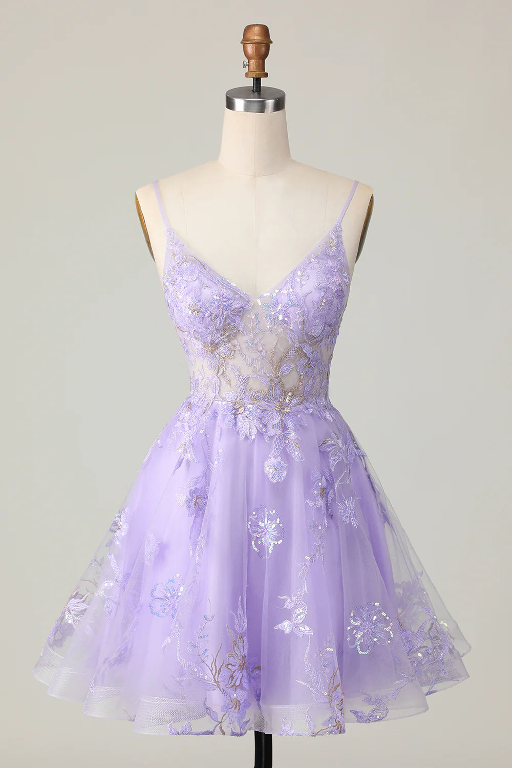 Full view of a sparkly purple A-line strapless homecoming dress with sequin floral patterns.