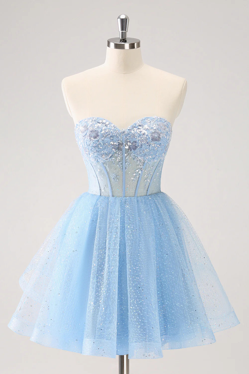 Sparkly sky blue A-line homecoming dress with sweetheart neckline and sequins.
